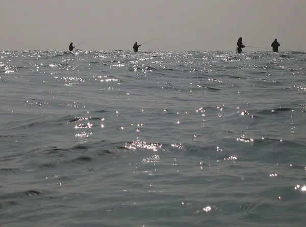 On a row - There were seven of them on a row, all firmly parked on a reef sticking out a couple of hundred yards. Anglers sure have a tendency to aggregate in certain areas, which are considered better than others. Actually I caught plenty fish right behind them, closer to the shore.